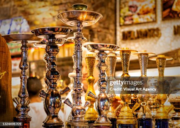 copper hookah are on the showcase at the shop sample of turkish copper art - hookah stock pictures, royalty-free photos & images