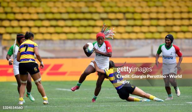 Nomenjanahary Sarindra Sahondramalala of Madacascar Women's National Team is tackled by Valentina Tapias of Colombia Women's National team during day...