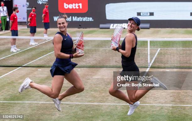 Victoria Azarenka and Aryna Sabalenka of Belarus celebrate with the trophy after winning the women's doubles final match against Demi Schuurs of...