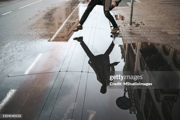one man in the shadow silhouette - s rain or shine stockfoto's en -beelden