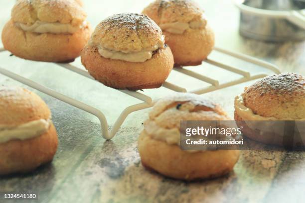 rhum coffee choux au craquelin - choux pastry stock pictures, royalty-free photos & images