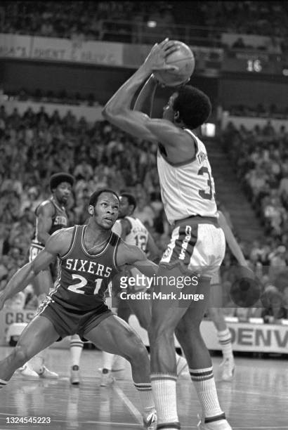 Philadelphia 76ers guard World B. Free guards Denver Nuggets forward David Thompson during an NBA basketball game at McNichols Arena on January 30,...
