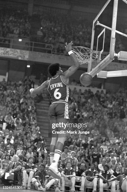 Philadelphia 76ers forward Julius “Dr. J” Erving dunks the ball during an NBA basketball game against the Denver Nuggets at McNichols Arena on...