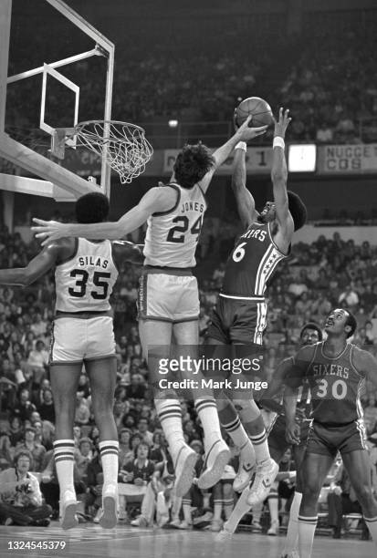 Denver Nuggets forward Bobby Jones blocks a shot by Philadelphia 76ers forward Julius “Dr. J” Erving during an NBA basketball game at McNichols Arena...