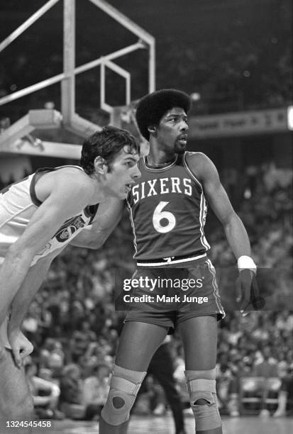 Philadelphia 76ers forward Julius Erving guards Denver Nuggets forward Bobby Jones during an NBA basketball game at McNichols Arena on January 30,...