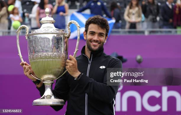 Matteo Berrettini of Italy poses with the trophy after winning the The cinch Championships during Day 7 of The cinch Championships at The Queen's...