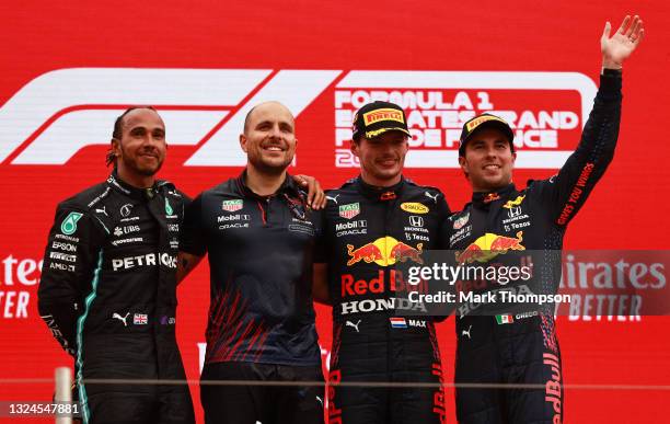 Second placed Lewis Hamilton of Great Britain and Mercedes GP, Red Bull Racing race engineer Gianpiero Lambiase, race winner Max Verstappen of...