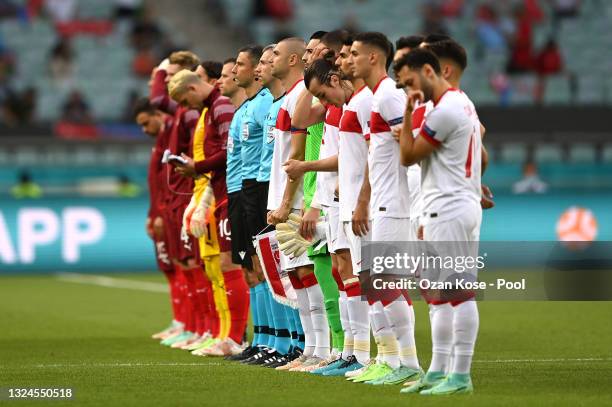 Both teams stand for the national anthem prior to the UEFA Euro 2020 Championship Group A match between Switzerland and Turkey at Baku Olimpiya...