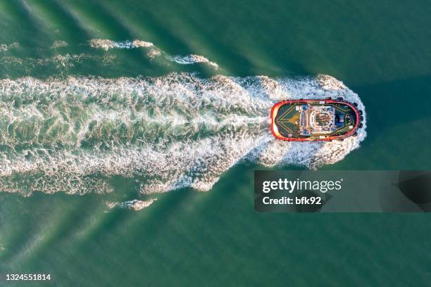 aerial view of a tugboat. - tug boat stock pictures, royalty-free photos & images