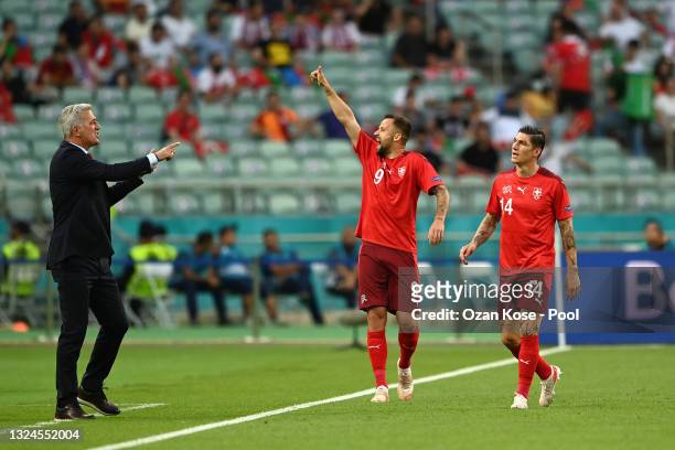 Haris Seferovic of Switzerland celebrates with Vladimir Petkovic, Head Coach of Switzerland after scoring his team's first goal during the UEFA Euro...