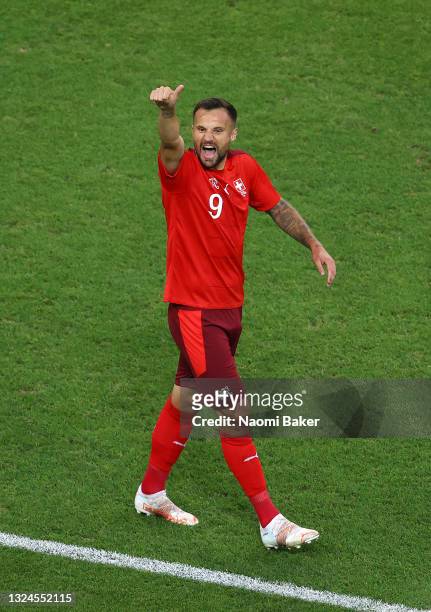 Haris Seferovic of Switzerland celebrates after scoring their team's first goal during the UEFA Euro 2020 Championship Group A match between...