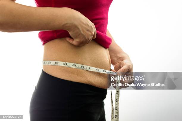 losing weight after pregnancy - estrias fotografías e imágenes de stock