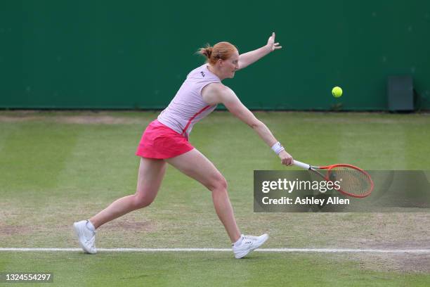 Alison Van Uytvanck of Belgium hits a backhand in the Finals match against Arina Rodionova of Australia during the ITF W100 Final of the Nottingham...