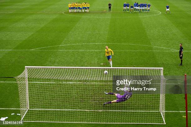 Brad James of Hartlepool United saves from Matt Buse of Torquay United to win the match and secure promotion to the Football League during the...