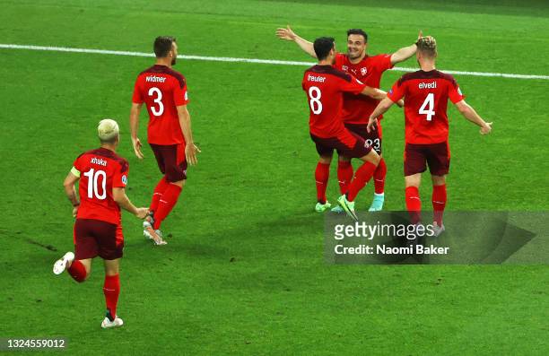 Xherdan Shaqiri of Switzerland celebrates with teammates after scoring their team's second goal during the UEFA Euro 2020 Championship Group A match...