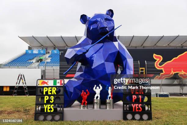 The race winners trophies of Max Verstappen of Netherlands and Red Bull Racing and third placed Sergio Perez of Mexico and Red Bull Racing are...