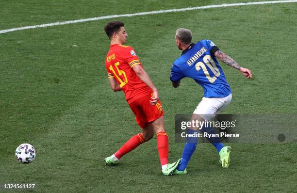 Ethan Ampadu of Wales fouls Federico Bernardeschi of Italy, a challenge he is then awarded a red card for during the UEFA Euro 2020 Championship...