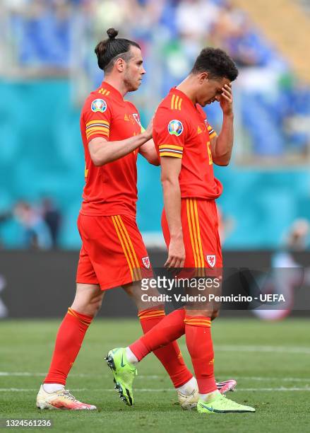 Ethan Ampadu of Wales looks dejected with team mate Gareth Bale after he is shown a red card by Match Referee, Ovidiu Hategan during the UEFA Euro...