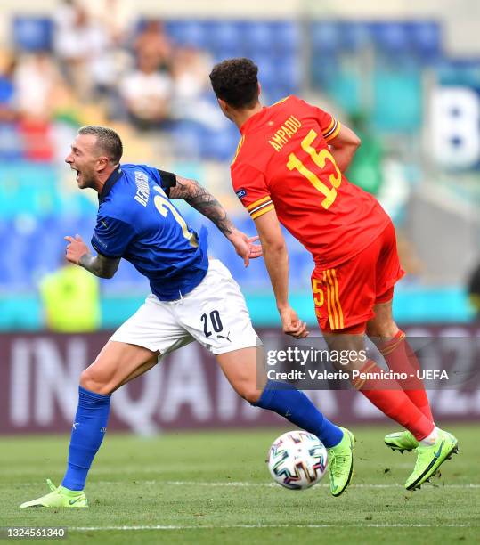 Federico Bernardeschi of Italy is fouled by Ethan Ampadu of Wales before he is shown a red card during the UEFA Euro 2020 Championship Group A match...