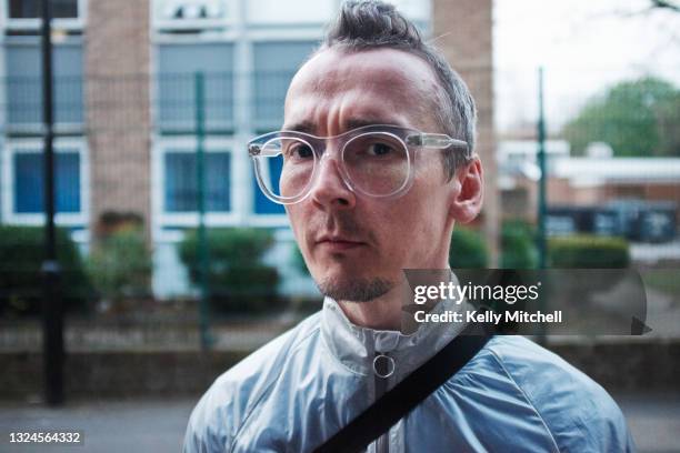 portrait of a british man with glasses looking at camera - staring stock pictures, royalty-free photos & images