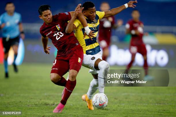 Ronald Hernandez of Venezuela competes for the ball with Gonzalo Plata of Ecuador during a Group B match between Venezuela and Ecuador as part of...