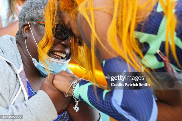 Sha'Carri Richardson celebrates winning the Women's 100 Meter final with grandmother Betty Harp on day 2 of the 2020 U.S. Olympic Track & Field Team...