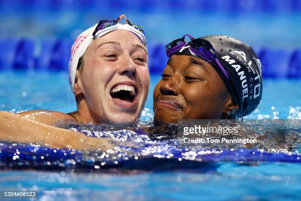 Abbey Weitzeil and Simone Manuel of the United States react after competing in the Women's 50m freestyle final during Day Eight of the 2021 U.S....