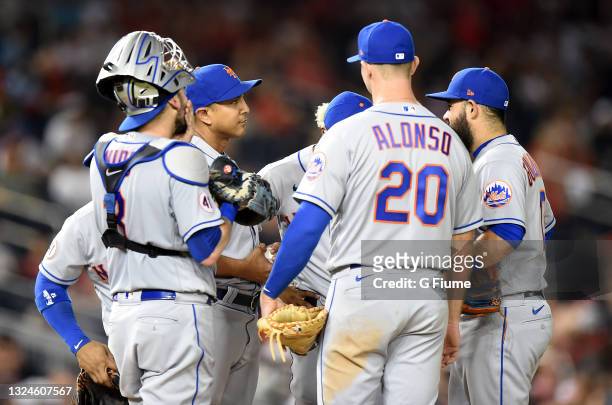 Manager Luis Rojas of the New York Mets talks to his players during the game against the Washington Nationals at Nationals Park on June 18, 2021 in...