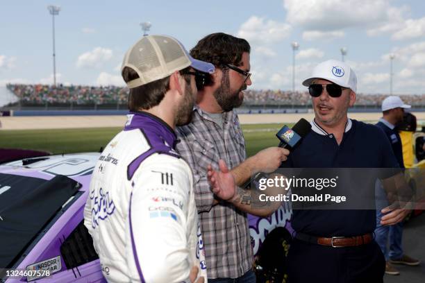 Singer and Trackhouse Racing Team co-owner Pitbull and Daniel Suarez, driver of the Tootsies Orchid Lounge Chevrolet, speak to the media on the grid...