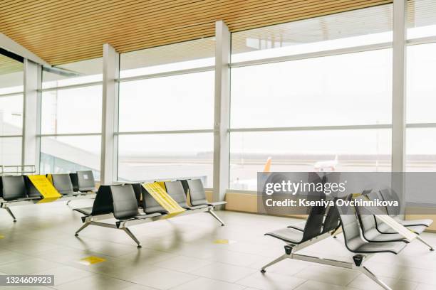 coronavirus outbreak, empty check-in desks at the airport terminal due to pandemic of coronavirus and airlines suspended flights. - travel ban - fotografias e filmes do acervo