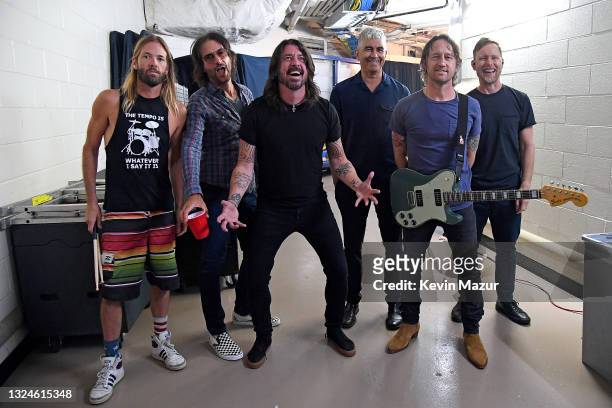 Taylor Hawkins, Rami Jaffee, Dave Grohl, Pat Smear, Chris Shiflett, and Nate Mendel pose backstage as The Foo Fighters reopen Madison Square Garden...