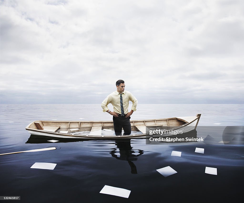Businessman in a sinking boat