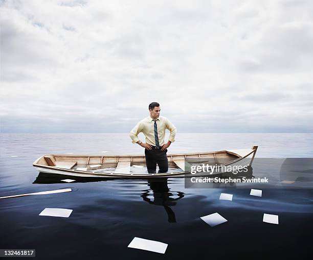 businessman in a sinking boat - crisis imagens e fotografias de stock