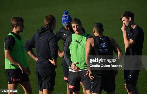 Luke Power the assistant coach of the Blues talks to his players during a Carlton Blues AFL media opportunity at Ikon Park on June 21, 2021 in...