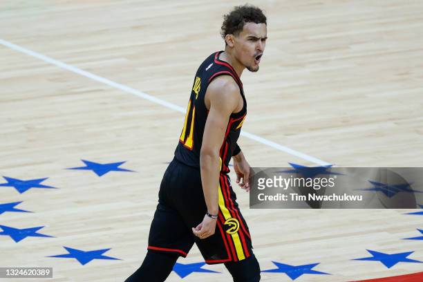Trae Young of the Atlanta Hawks celebrates during the fourth quarter against the Philadelphia 76ers during Game Seven of the Eastern Conference...