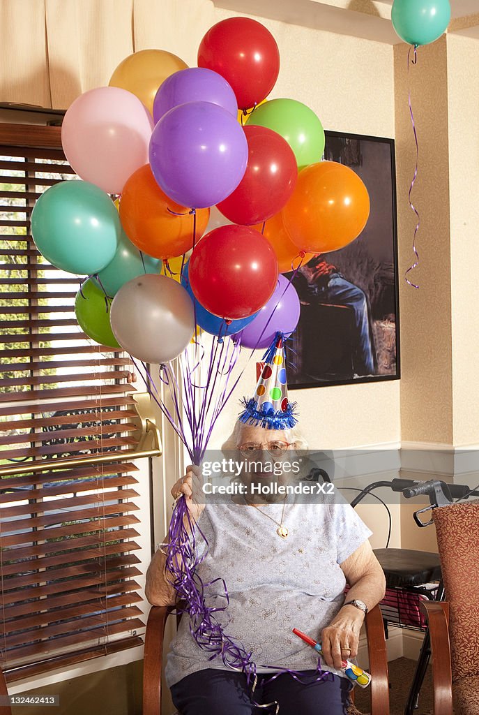 Senior woman with balloons
