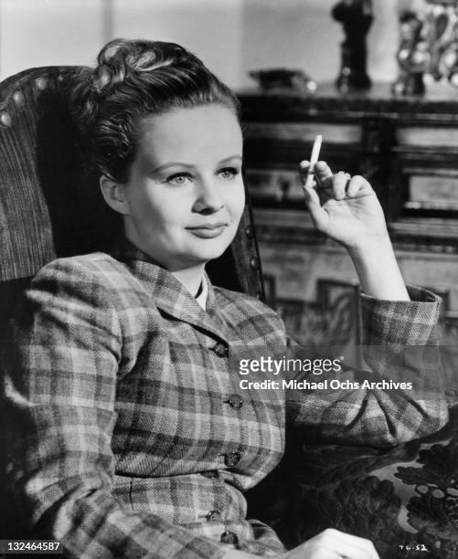 Mary-Robin Redd sitting and relaxing with a cigarrette in a scene from the film 'The Group', 1966.