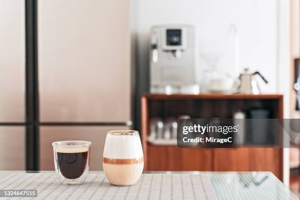 homemade americano and macchiato coffee on table - coffee table ストックフォトと画像