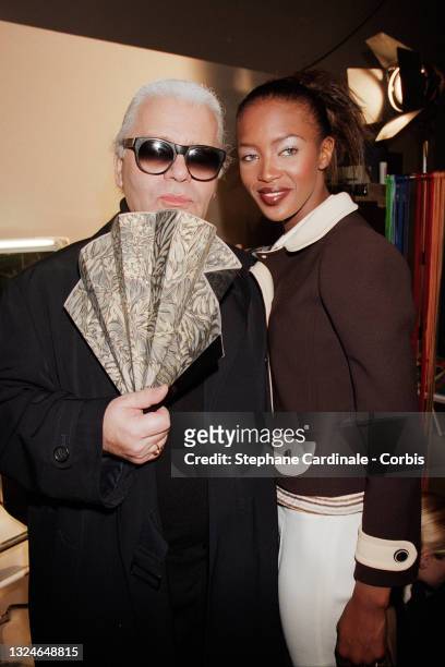 Fashion designer Karl Lagerfeld and model Naomi Campbell pose after the Lagerfeld Ready to Wear Fall/Winter 1996/97 show as part of Paris Fashion...
