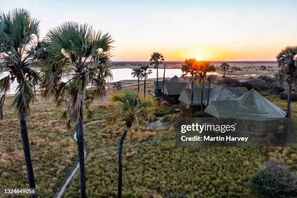 aerial view of the beautiful tented safari lodge jack's camp on the makgadikgadi pans, botswana - safari lodge stock pictures, royalty-free photos & images