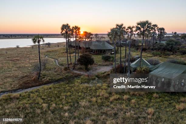 aerial view of the beautiful tented safari lodge jack's camp on the makgadikgadi pans, botswana - safari lodge stock pictures, royalty-free photos & images