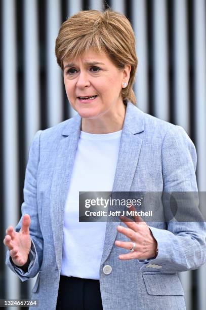 Scotland's First Minister Nicola Sturgeon talks with the media after receiving her second dose of the Oxford/AstraZeneca Covid-19 vaccine at the NHS...