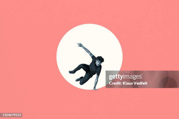 young man jumping from white circle - initiative stock-fotos und bilder