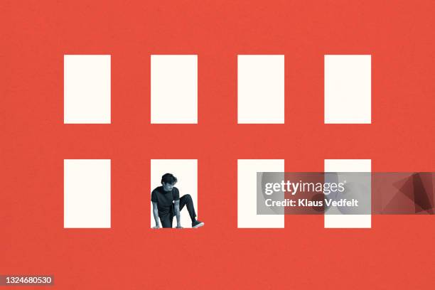 young man coming out of rectangle - initiative stock pictures, royalty-free photos & images
