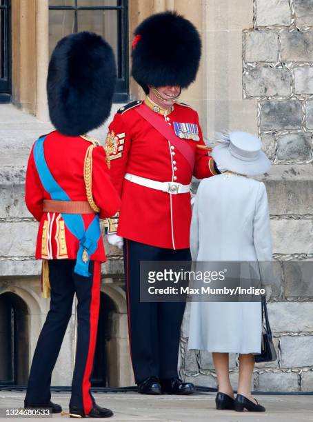 Prince Edward, Duke of Kent and Queen Elizabeth II talk with Garrison Sergeant Major Andrew 'Vern' Stokes during a military parade, held by the...