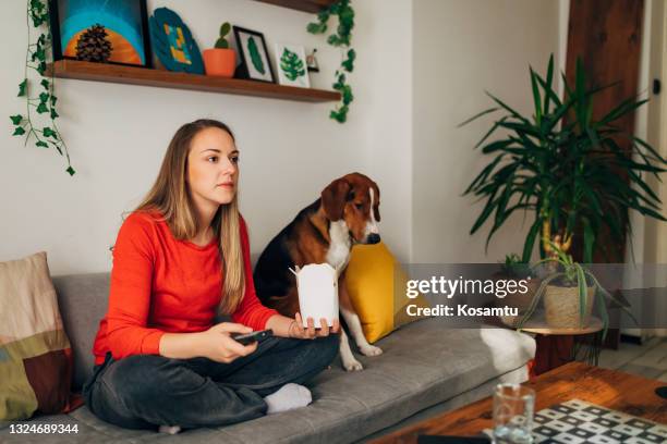 watching tv is our favourite part and also an tradition during lazy sunday day - chinese takeout stock pictures, royalty-free photos & images