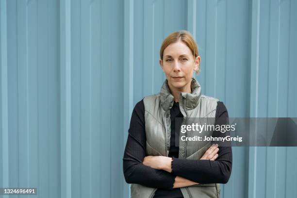 portrait of early 40s caucasian woman with hair pulled back - hair back stock pictures, royalty-free photos & images