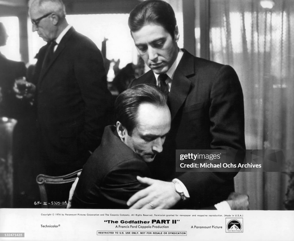 John Cazale holds his brother Al Pacino in a scene from the film 'The