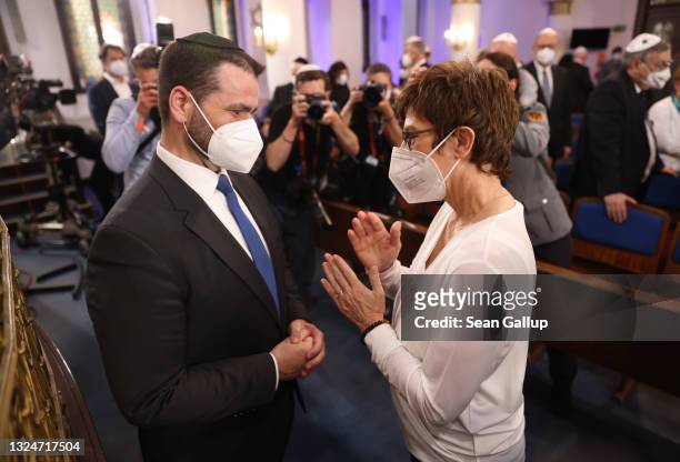 German Defense Minister Annegret Kramp-Karrenbauer congratulates Rabbi Zsolt Balla following the ceremony in which he was officially inaugurated as...