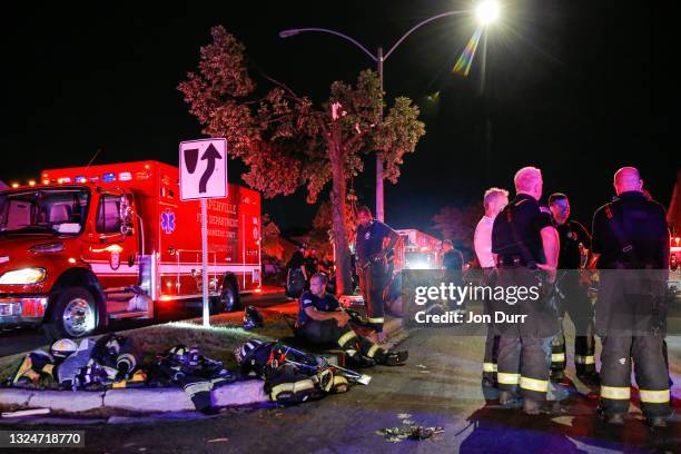 Emergency crews gather at the intersection of Ranchview Drive and Cobblebrook Lane on June 21, 2021 after a tornado came through the area in...